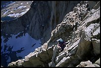 Mountaineer among broken rocks in the East face of Mt Whitney. Sequoia National Park, California (color)