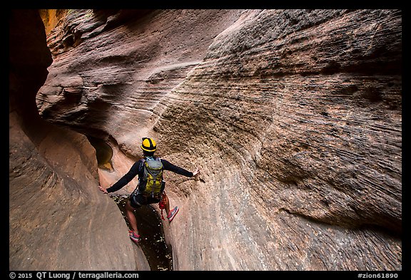 Hiker in slot canyon, Mystery Canyon. Zion National Park, Utah (color)