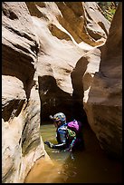 Canyoneer in sunny pool of water, Pine Creek Canyon. Zion National Park, Utah ( color)