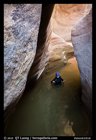 Woman standing in waist-high pool in Pine Creek Canyon. Zion National Park, Utah (color)