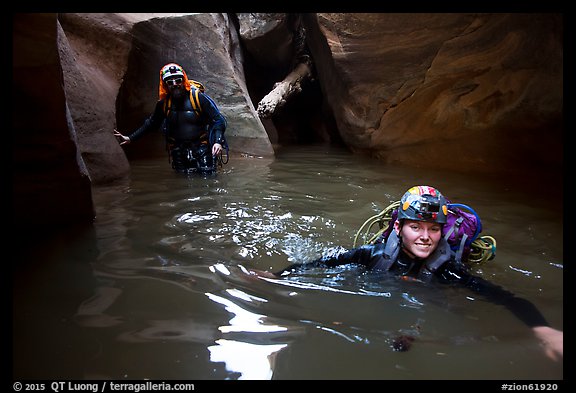 Canyoneers negotiating a deep pool in Pine Creek Canyon. Zion National Park, Utah (color)