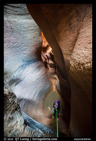 Descending using ropes into the depths of Keyhole Canyon. Zion National Park, Utah (color)