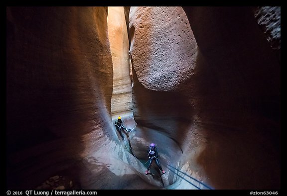 Canyoneers deep in subterranean part of Keyhole Canyon. Zion National Park, Utah (color)