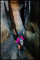 Canyoneer in tight squeeze, Das Boot Canyon. Zion National Park, Utah ( color)