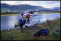 Backpackers beeing dropped off by a floatplane at Circle Lake. Gates of the Arctic National Park, Alaska ( color)