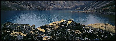 Dark rocks, lichen, and mountain lake. Gates of the Arctic National Park (Panoramic color)