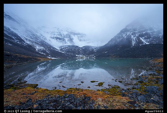 Lake and Three River Mountain emerging from the clouds. Gates of the Arctic National Park (color)
