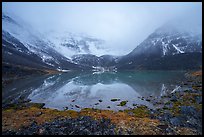 Lake and Three River Mountain emerging from the clouds. Gates of the Arctic National Park ( color)