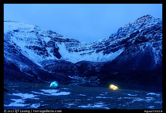Lighted tents at night and Three River Mountain. Gates of the Arctic National Park (color)
