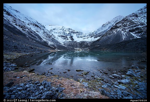 Partly frozen lake and Three River Mountain, dawn. Gates of the Arctic National Park (color)