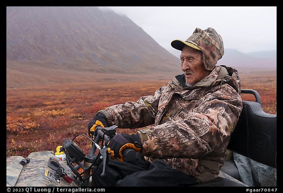Nunamiut subsistence hunter driving Argo vehicle. Gates of the Arctic National Park (color)