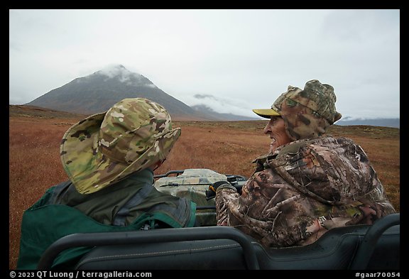 Nunamiut man and passenger on ATV. Gates of the Arctic National Park (color)