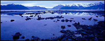 Blue scenery of water and mountains at dusk. Glacier Bay National Park, Alaska, USA.