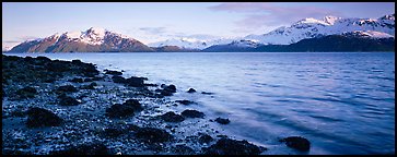 Fjord landscape with mountains rising above inlet. Glacier Bay National Park (Panoramic color)