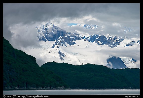 Dark ridge and cloud shrouded peaks, West Arm. Glacier Bay National Park, Alaska, USA.