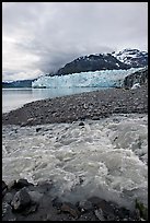 Stream flowing into Tarr Inlet, with Margerie Glacier in background. Glacier Bay National Park, Alaska, USA.