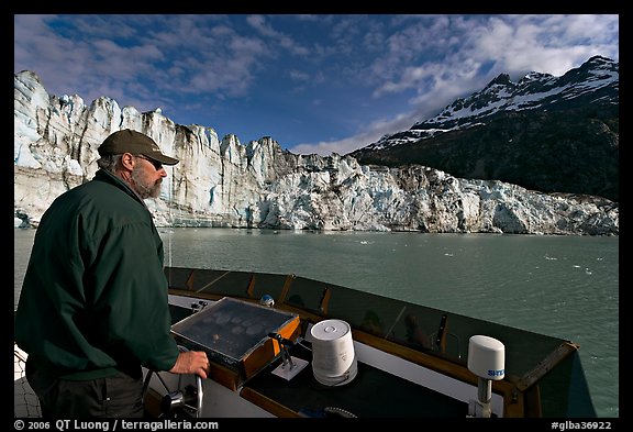 Captain guiding boat near Lamplugh glacier. Glacier Bay National Park (color)