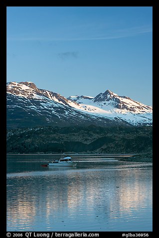 Small boat at the head of Tarr Inlet, early morning. Glacier Bay National Park, Alaska, USA.