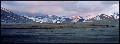 Desert-like ash-covered valley surrounded by snowy peaks. Katmai National Park (Panoramic color)