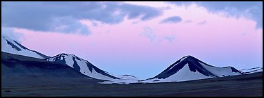 Snow-covered mountains with pink dusk sky. Katmai National Park (Panoramic color)