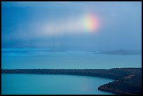 Rainbow in sun shaft piercing clouds. Katmai National Park ( color)