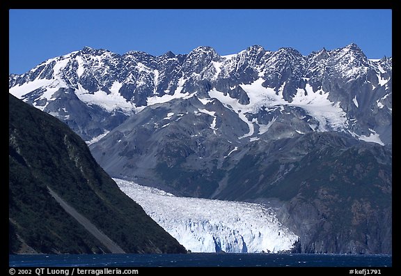 Aialik Glacier, fjord,  and steep mountains. Kenai Fjords National Park, Alaska, USA.