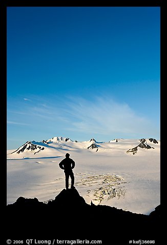 Hiker standing on overlook above Harding icefield. Kenai Fjords National Park (color)