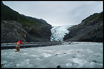 Hiker crosses glacial stream, Exit Glacier. Kenai Fjords National Park ( color)
