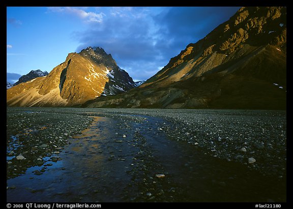 Stream on wide gravel bar and peaks at sunset. Lake Clark National Park (color)