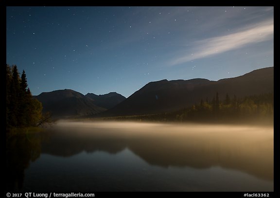 Kontrashibuna Lake with thin layer of mist at night. Lake Clark National Park, Alaska, USA.