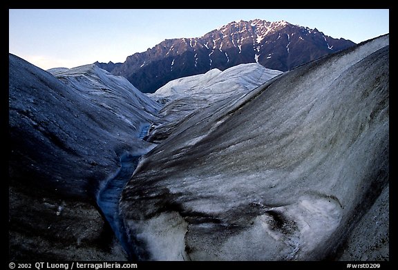 Root Glacier, glacial stream, and mountains at dusk. Wrangell-St Elias National Park (color)