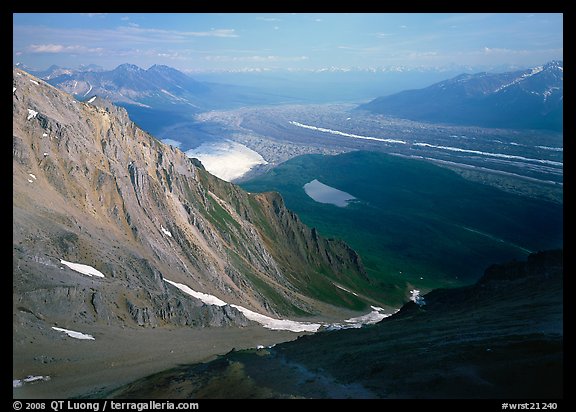 View over hazy Chugach mountains and Kennicott Glacier from Mt Donoho. Wrangell-St Elias National Park, Alaska, USA.