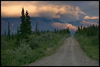 Nabena road at sunset with last light on mountains. Wrangell-St Elias National Park, Alaska, USA.