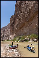 Canoeists bellow steep walls of Boquillas Canyon. Big Bend National Park, Texas, USA. (color)