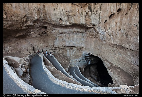 Tourists walking down natural entrance. Carlsbad Caverns National Park (color)