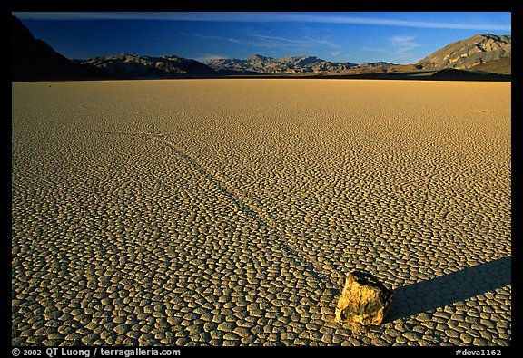 Tracks, moving rock on the Racetrack, late afternoon. Death Valley National Park, California, USA.