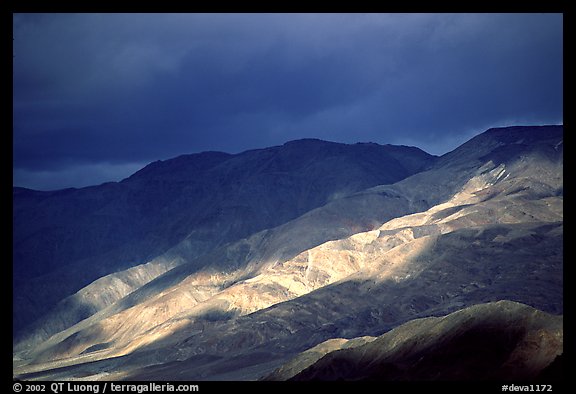 Storm light on foothills. Death Valley National Park, California, USA.