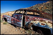 Car with bullet holes near Aguereberry camp, afternoon. Death Valley National Park, California, USA.