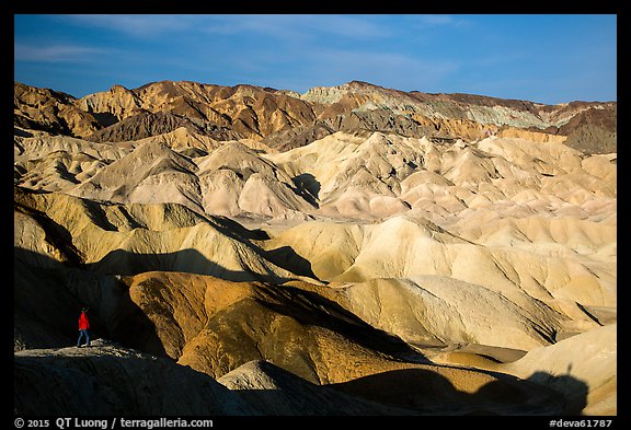 Visitor looking, Twenty Mule Team Canyon. Death Valley National Park (color)