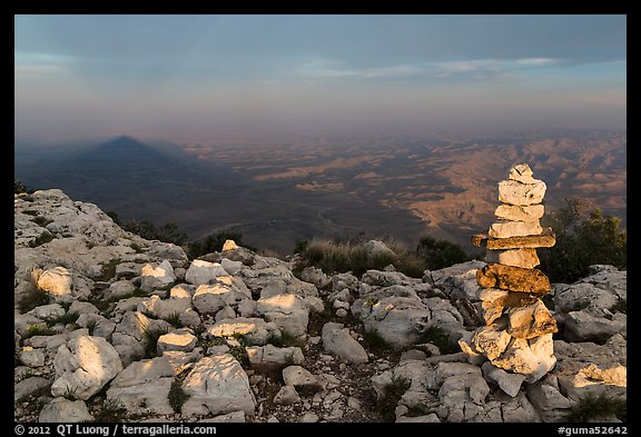 Cairn and shadow of mountain, Guadalupe Peak. Guadalupe Mountains National Park, Texas, USA.