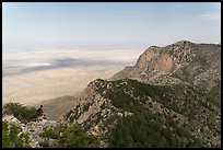 Hiker surveying view over mountains and plains. Guadalupe Mountains National Park, Texas, USA. (color)
