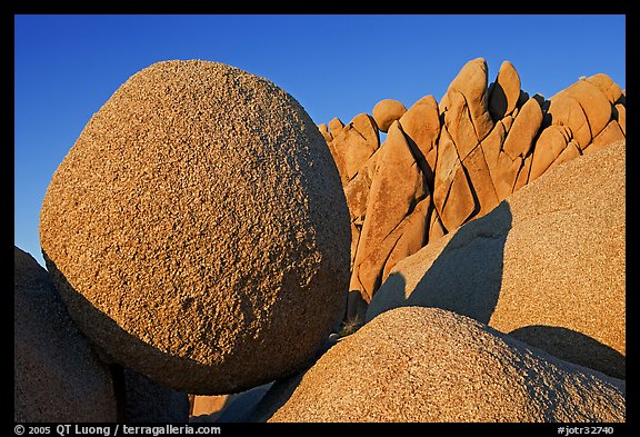 Round and triangular Boulders, Jumbo Rocks campground, sunset. Joshua Tree National Park, California, USA.