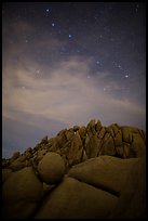 Geometrically shaped rocks and stars at night. Joshua Tree National Park, California, USA.