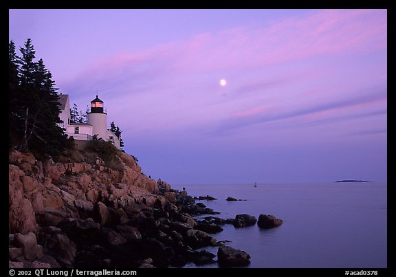 Bass Harbor lighthouse on rocky coast, sunset. Acadia National Park (color)