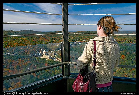 Tourist looking at the view from Hot Springs Mountain Tower in the fall. Hot Springs National Park, Arkansas, USA.