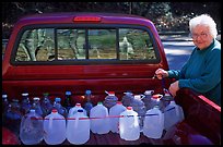 Resident stocks up on natural spring water. Hot Springs National Park, Arkansas, USA. (color)