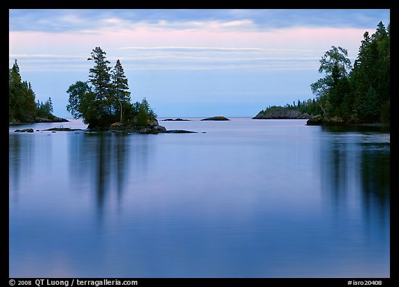Tree-covered islet and smooth waters, Chippewa Harbor. Isle Royale National Park (color)