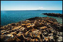Lichen-covered rocks, Lake Superior, and Isle Royale from Passage Island. Isle Royale National Park ( color)