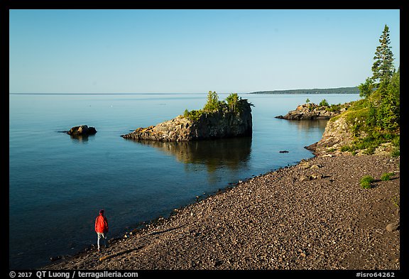 Visitor looking, Mott Island. Isle Royale National Park (color)
