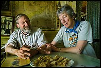 Rolf Peterson and Carolyn Peterson with plate of rhubarb pie in their home. Isle Royale National Park ( color)